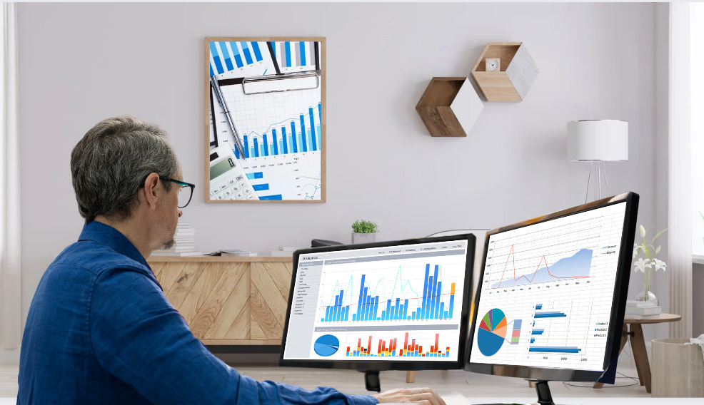 A data analyst using 2x16:9 monitors for data analytics