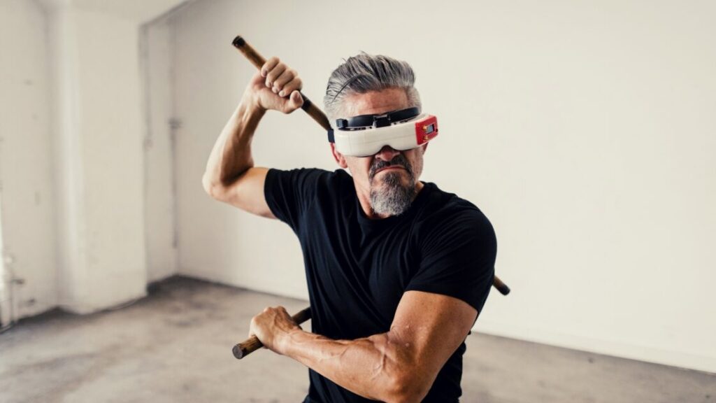 A 50-60 year old man enjoying his retired life with futuristic virtual reality technology